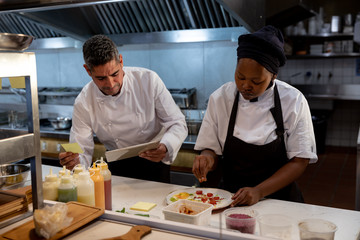 Restaurant staff preparing orders in the kitchen