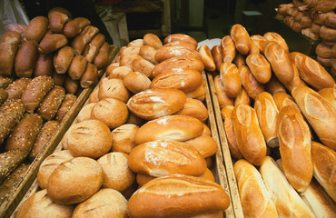Fresh baked bread at the market closeup. Food background concept