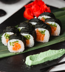 Black sushi with rice ginger and wasabi