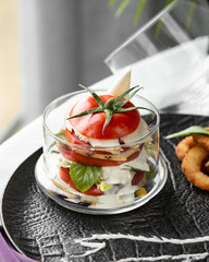 Tomato burger with chicken and sauce