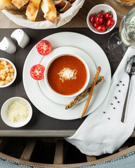 Tomato soup with cheese crackers and cherry tomatoes