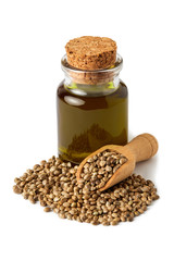 Organic hemp seeds and hemp oil isolated on white background