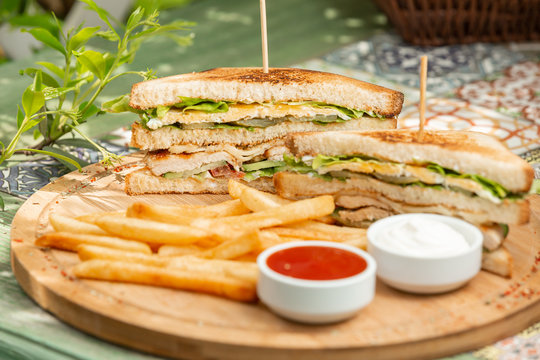 Classic chicken club sendwich with french fries