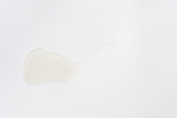 Sample of cosmetic transparent gel on a light background. The concept of cosmetics, beauty care, minimalism, top view, place for text.