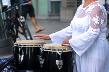 Cropped image of a drummer player, outdoors