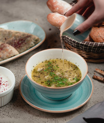 Azeri dushbere with dried mint and vinegar