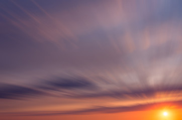 Naklejka na ściany i meble Dawn orange sun in dramatic clouds in the early morning.