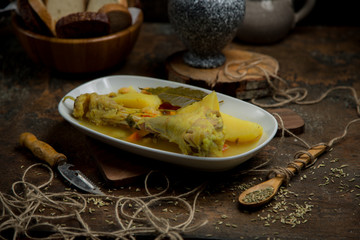 Boiled chicken with vegetables on the table