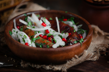 Fried sausage with onion and pomegranate