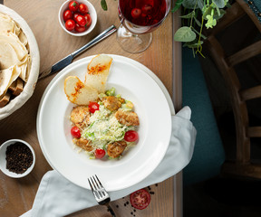 Chicken ceasar salad with crutones and vegetables