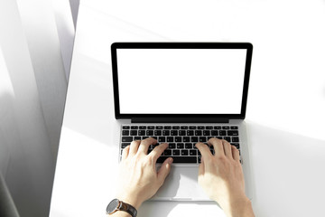 Mockup image of a man working at the laptop