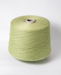 bobbin of yarn on a white background. Side view.Textile reel on isolated white background.