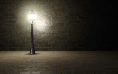 Illuminated brick wall with old fashioned street light.3d rendering