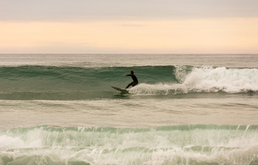Fototapeta premium Surfer at sunset