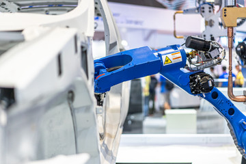 robot arm working in car factory