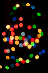 multicolored round bokeh on black background
