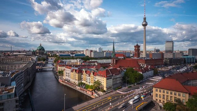 Berlin, Germany, zoom out time lapse view of Central Berlin showing television tower, Berlin Cathedral (Berliner Dom) and tour boats on the Spree River by day during fall season. 