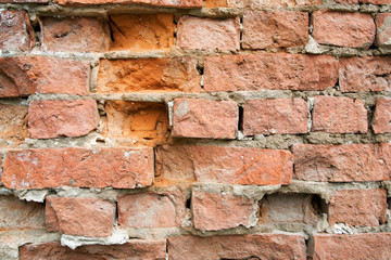 Texture of an old red stone brick wall