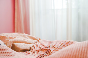 Pink pastel tone bedroom, cozy pink blanket