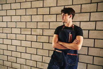 Young chef holding knife. Food concept.