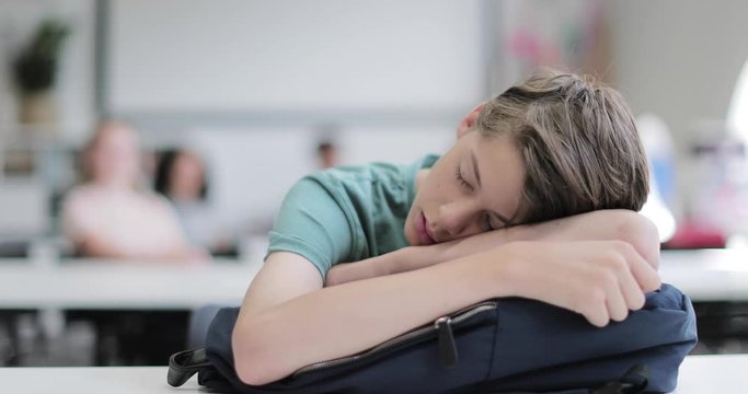 Closeup of student asleep in class