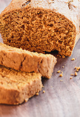 Abstract of cut fresh baked homemade pumpkin bread. Selective focus on middle of bread with extreme blurred foreground and background.
