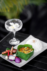 tradtional cambodian amok fish curry meal on restaurant table