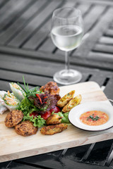 mixed asian seafood snacks platter on restaurant table
