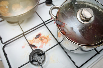 cockroaches on dirty dishes in the kitchen. Poor hygiene