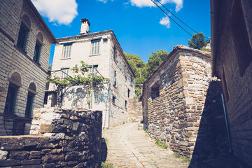 Traditional alley in Mikro Papingo village in Ioannina during summer, Greece