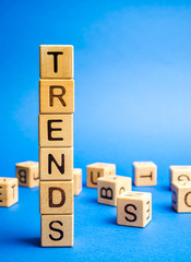 Wooden blocks with the word Trends. Popular and relevant topics. New ideological trends. Recent and...