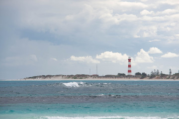 red and white lighthouse landscape
