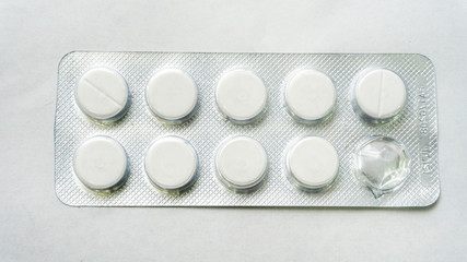 Tablets or pills in the packet on a isolated white background.