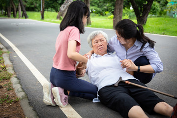 Sick asian senior mother with heat stroke,high temperature,vertigo on floor after falling...