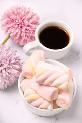 breakfast with coffee and marshmallows. Breakfast on a light background. Gentle breakfast.