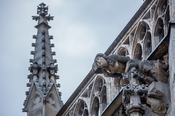 Elements of Gothic architecture. Grotesque, chimera and gargoyle sculptures on the facade of an...