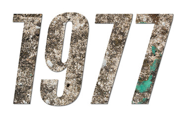 Year 1977 with old concrete wall on white background
