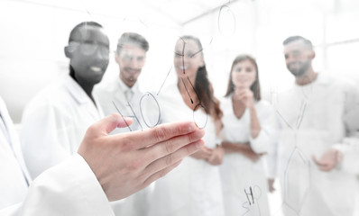 gay biologists are discussing a formula that is written on the board