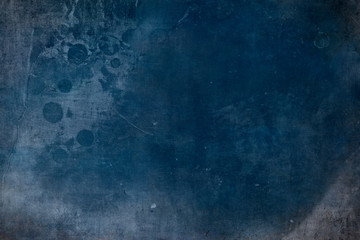 Distressed blue grungy wall background