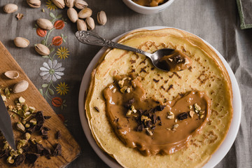 Thin Crepes with Butterscotch and almonds and chopped chocolate. Top view