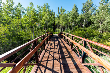 Snowmass Aspen village town in Colorado downtown with bridge at Brush Creek trail with nobody in summer wide angle view