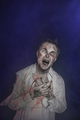 Horror terrible zombie man screaming. Halloween scene
