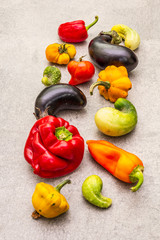 Trendy ugly organic vegetables. Assortment of fresh pepper, eggplant, cucumber, tomato, pumpkin