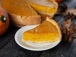 Traditional American pumpkin pie for thanksgiving in the fall. Delicious homemade cake