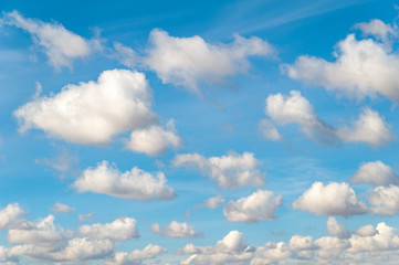 Naklejka na ściany i meble Clouds on blue sky in autumn day.