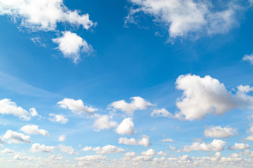 Naklejka na ściany i meble Clouds on a blue sky in a cold autumn morning.
