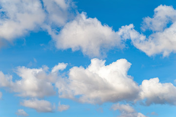 Close-up of clouds on a blue sky above the horizon on a cold autumn day.