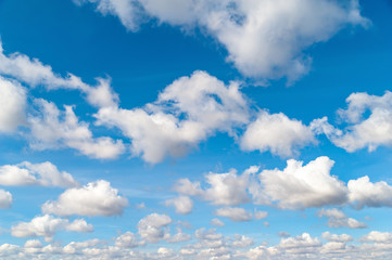 Fototapeta na wymiar Clouds on a blue sky over the horizon in autumn morning.