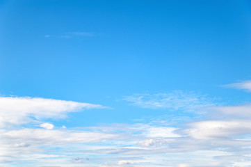 Clouds on a blue sky above the horizon on a cold autumn day.