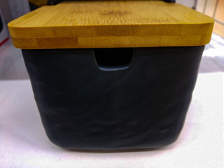black box with a cover for cereals